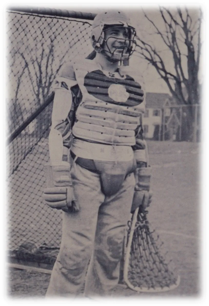 Vintage black and white photo of Oren Lyons wearing his Syracuse University lacrosse goalie gear and holding a lacrosse stick.